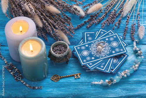Obraz na płótnie Blue tarot cards deck on blue wooden table background.