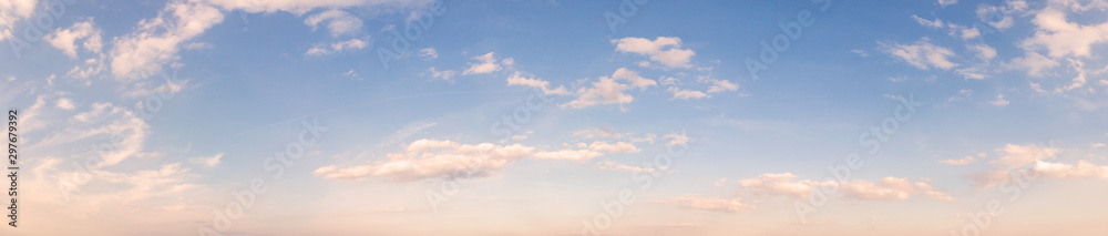 Summer sky background with warm sunny tonings. Wide angle panorama, banner