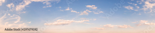 Summer sky background with warm sunny tonings. Wide angle panorama, banner