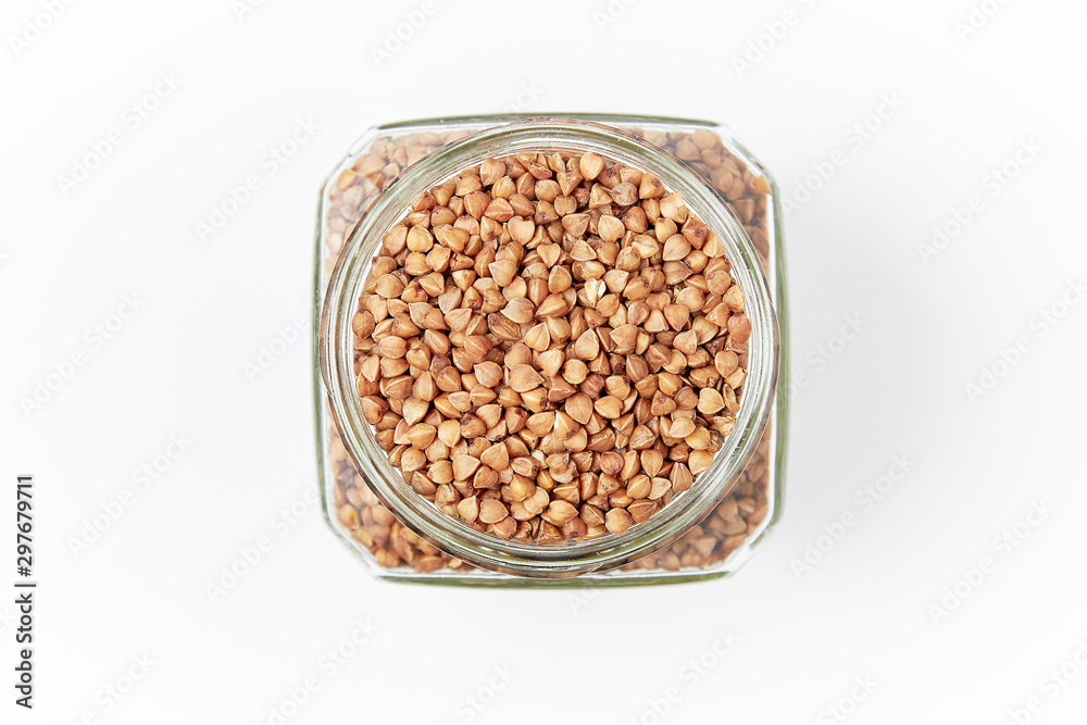 buckwheat in a jar on a white background