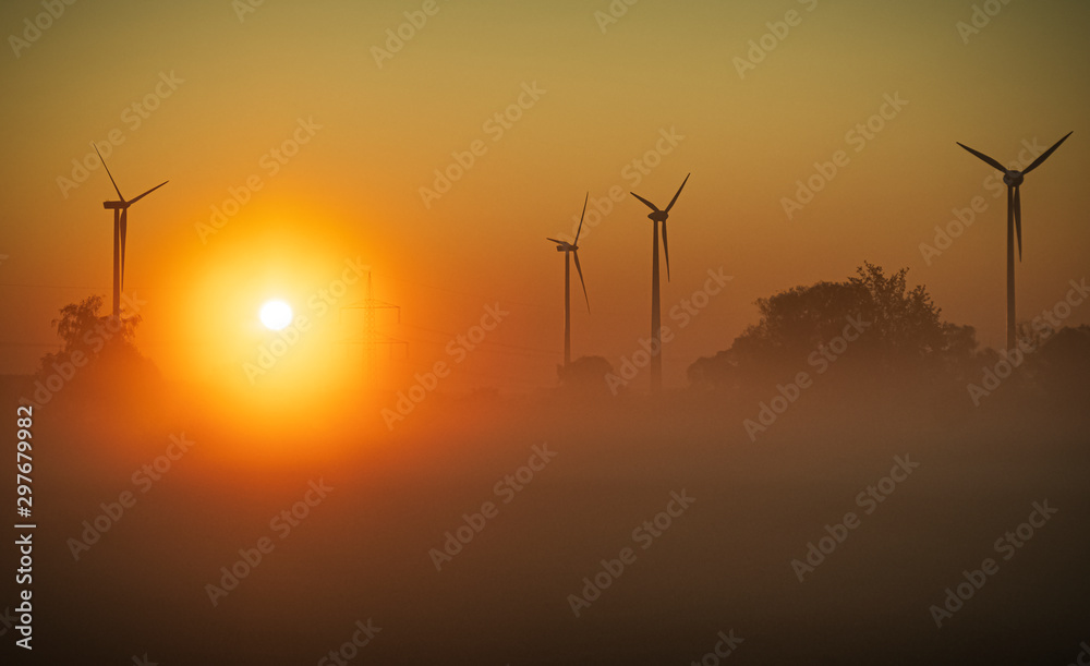 Wind turbines in the background of dawn in the fog. Wind turbines in the background of dawn in the fog.