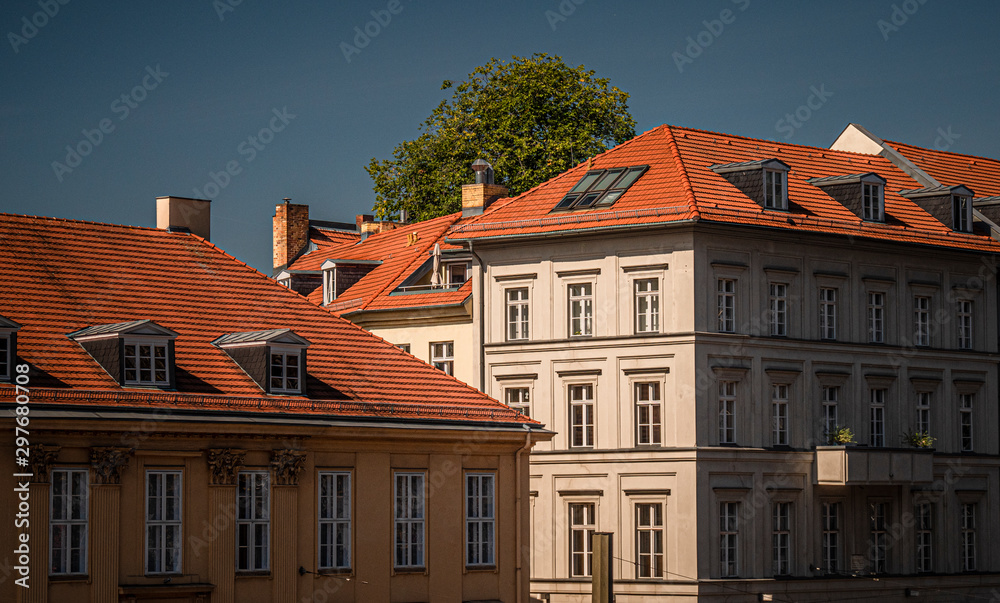 Germany, Berlin - August 23, 2019: German residential buildings with red roofs.