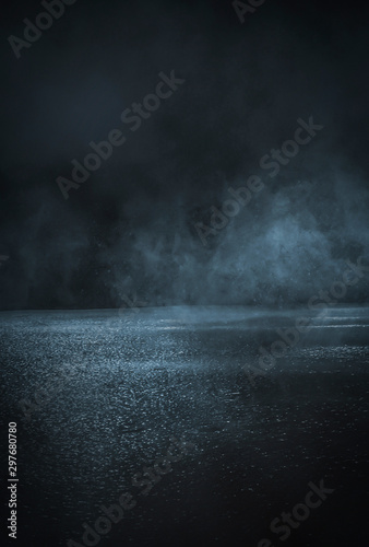 Empty background scene. Dark street reflection on the wet pavement. Rays neon light in the dark, neon figures, smoke. Night view of the street, the city. Abstract dark background. Abstract spotlight.