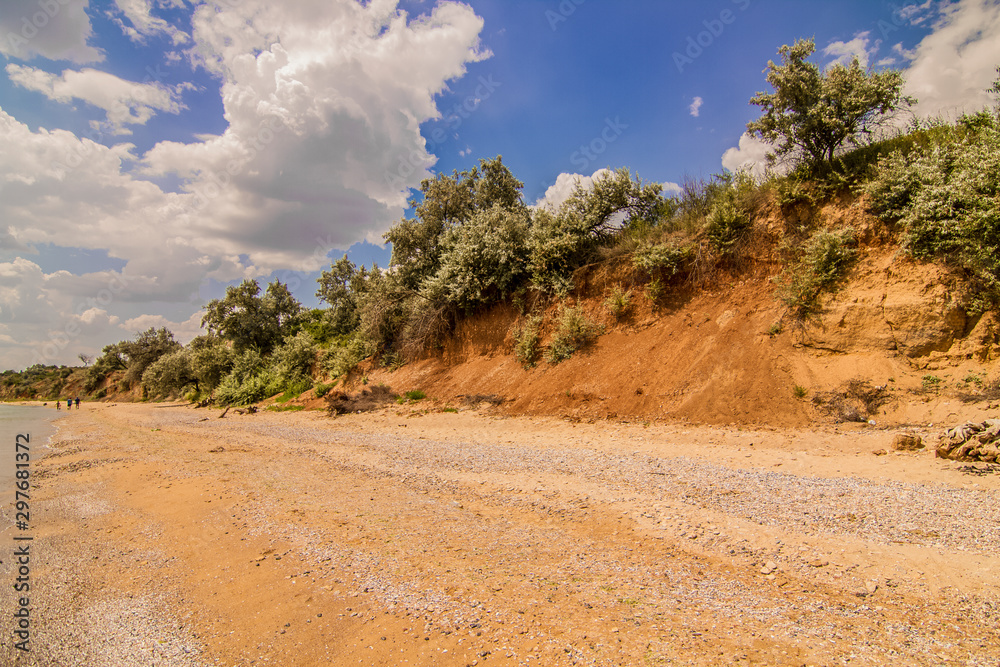 Clay orange cliffs over the sea empty promenade.