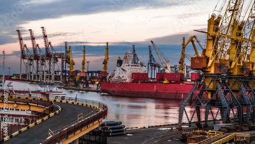 Ukraine, Odessa - August 1, 2019: Panorama of a trading port with cranes and a ship.