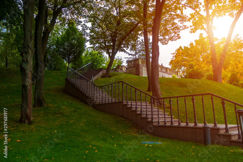 Beautiful stone staircase in the park leading up photo