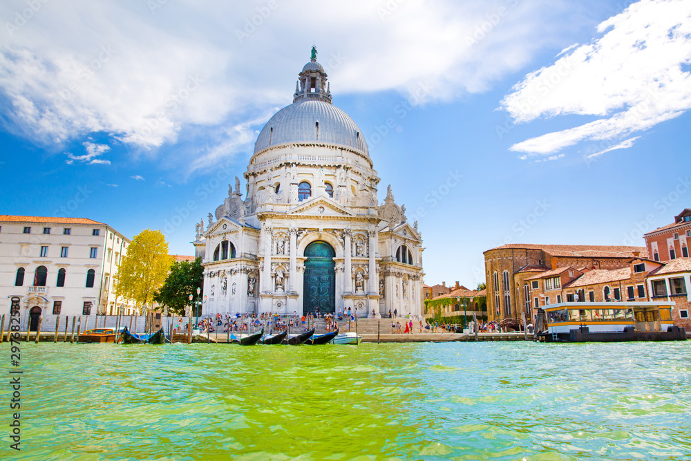 Grand Canal and Basilica Santa Maria della Salute in Venice, Italy. Sunny summer day with blue sky. 