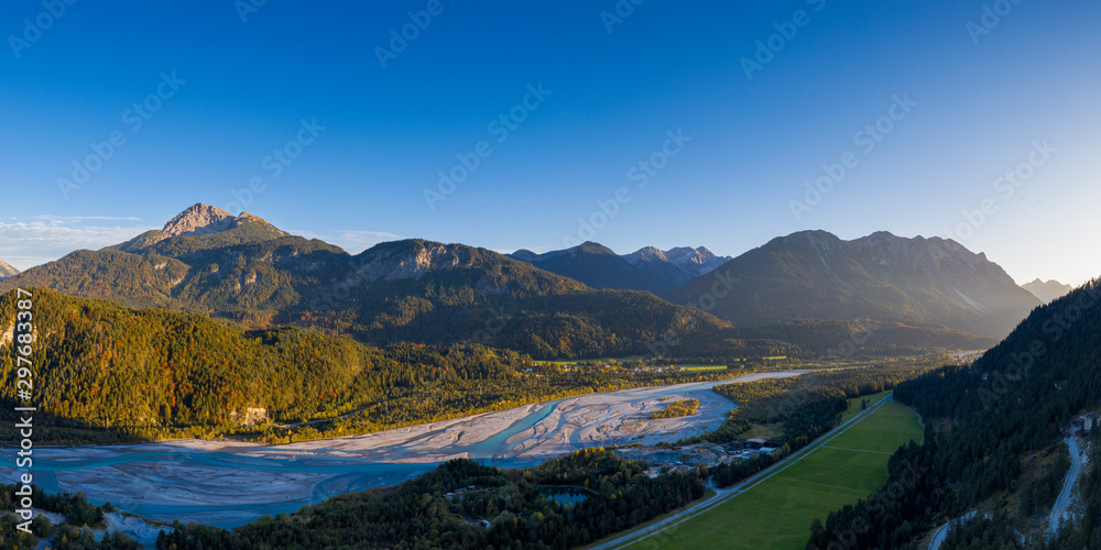 lech river plait in hoefen reutte austria at fall sunset with mountains