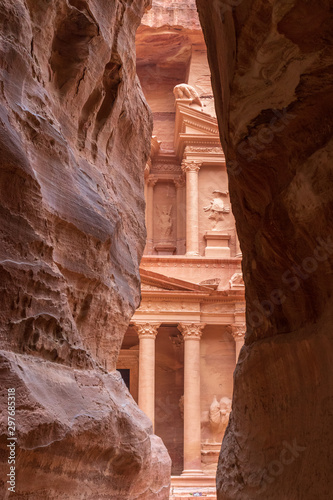 View of Treasury at Petra, Jordan through desert cliffs