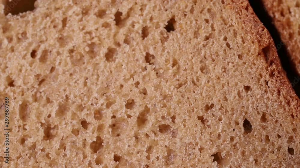 the crumb of bread rotates slowly. macro background the crumb of bread rotates slowly. macro background