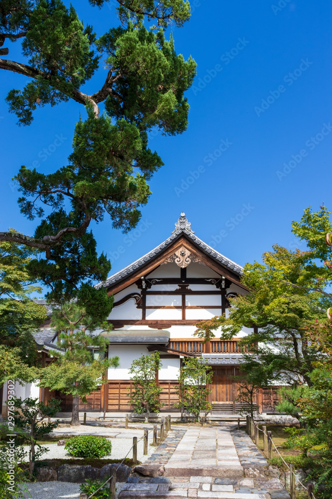 Traditional building and garden with blue sky in Kyoto Japan