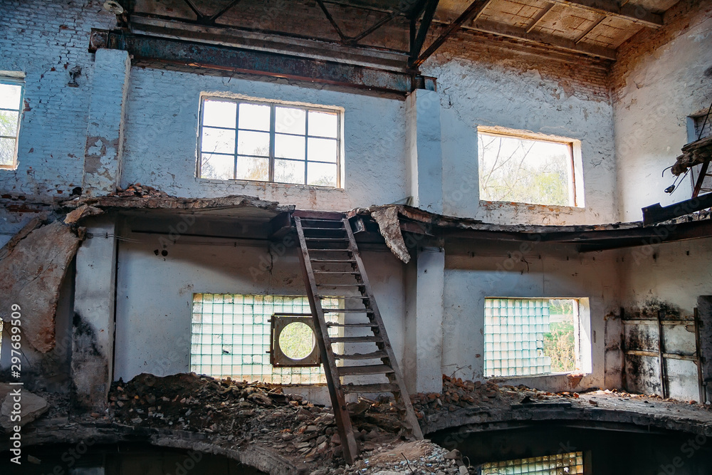 Old abandoned and ruined red brick building interior of former sugar factory in Ramon, Voronezh region