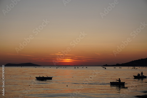 fishing boat, boats and people on Sunset Beach