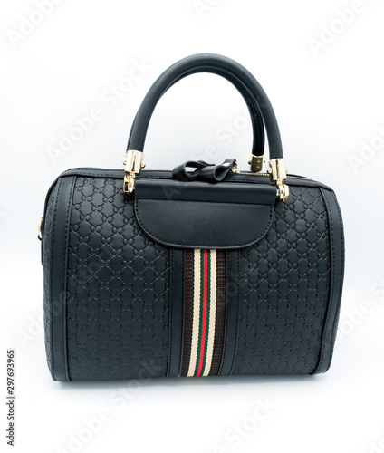 Women's black leather handbag isolated on white background