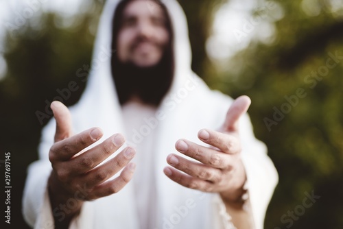 Canvas Print Biblical scene - of Jesus Christ landing his hands with a blurred background