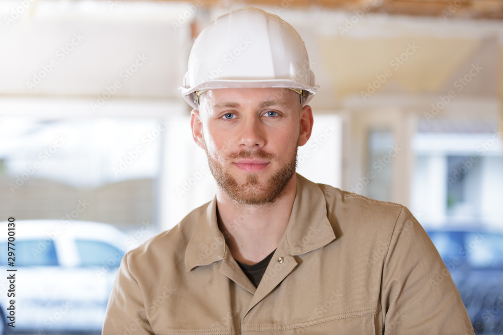 portrait of a happy builder worker at construction site portrait of a happy builder worker at construction site