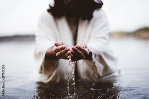 Fotografia, Obraz Biblical scene - of Jesus Christ drinking water with his hands