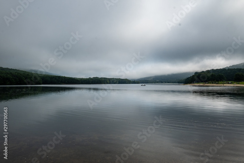 Lake, mountains and grey sky