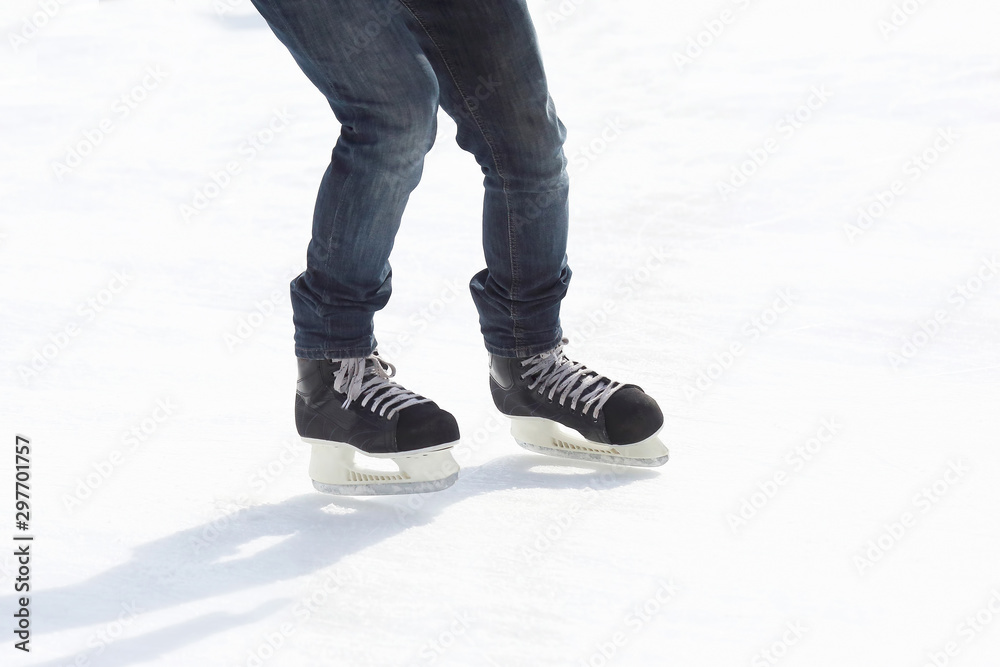 legs ride a guy skating on the ice rink. legs ride a guy skating on the ice rink.