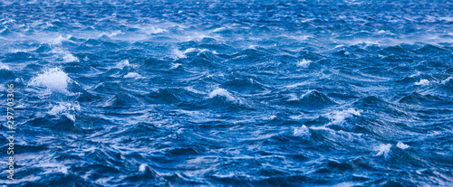Abstract ocean wave angle view of rippled stormy Water background texture.