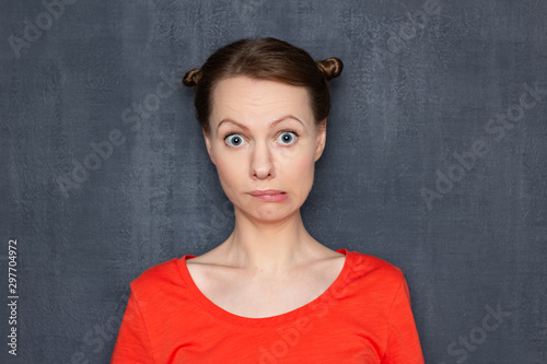 Portrait of surprised perplexed girl looking like stupid user © Andrei Korzhyts