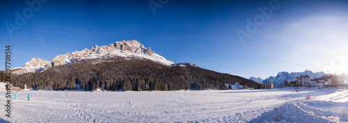 Lake Misurina in the Italian Dolomites in the winter  winter covered with snow. The hotel backed on to the mountains. Close photo of the hotel. photo