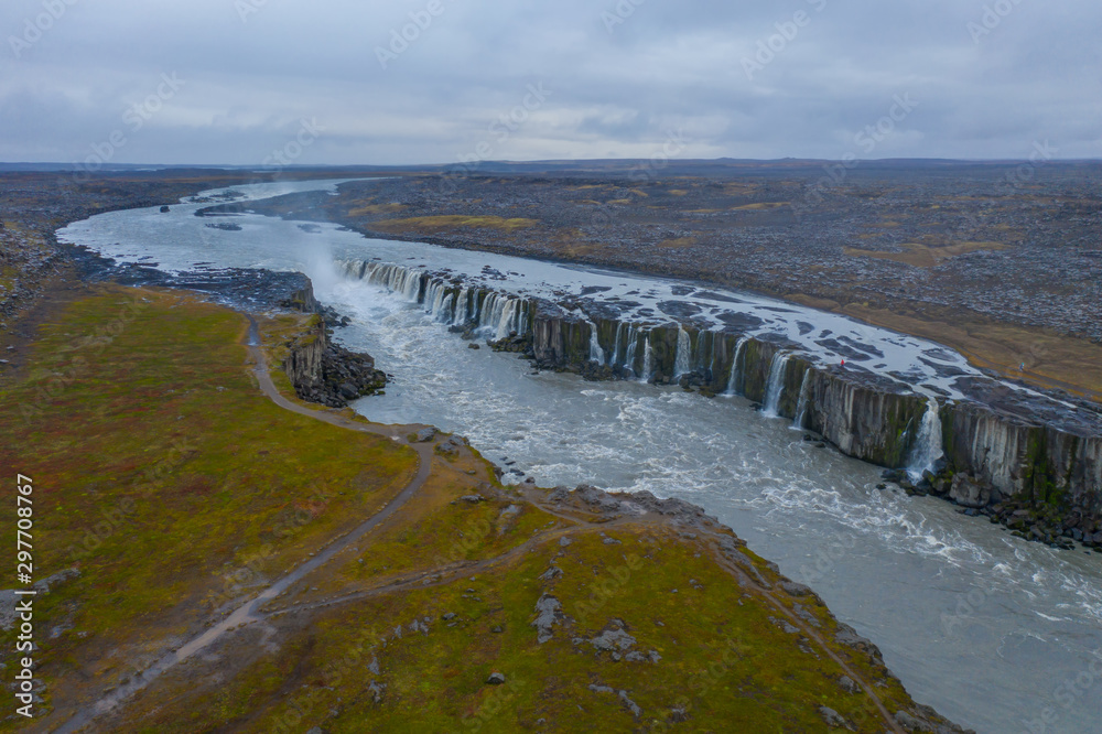 Selfoss waterfall in Iceland. Beautiful landscape and cascade of Selfoss attracts tourist to visit Northeastern Iceland. It is located near Dettifoss waterfall. Aerial drone shot in september 2019