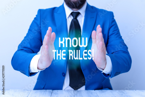 Word writing text Know The Rules. Business photo showcasing set explicit or regulation principles governing conduct Man holds empty paper with copy space in front of him Space