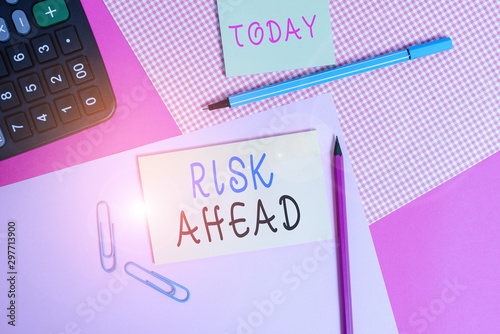 Handwriting text writing Risk Ahead. Conceptual photo A probability or threat of damage, injury, liability, loss writing equipments with stationary and plain note paper placed on the table