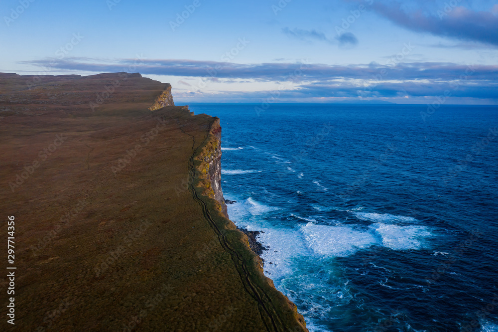 Stunning Latrabjarg cliffs, Europe's largest bird cliff and home to millions of birds. Western Fjords of Iceland. Sunset in september 2019. Aerial drone shot