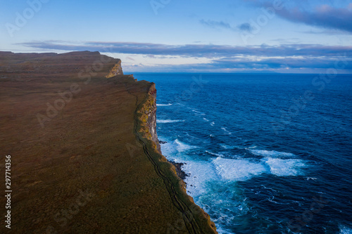 Stunning Latrabjarg cliffs, Europe's largest bird cliff and home to millions of birds. Western Fjords of Iceland. Sunset in september 2019. Aerial drone shot