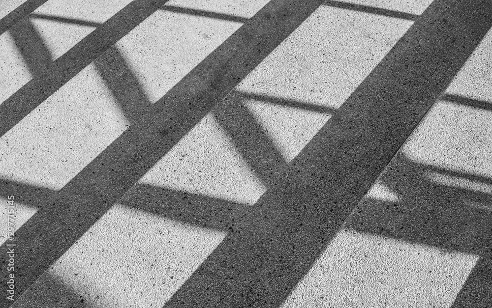 Architectural design of stair concrete with shadow looking at a mirage Black and white. - obrazy, fototapety, plakaty 