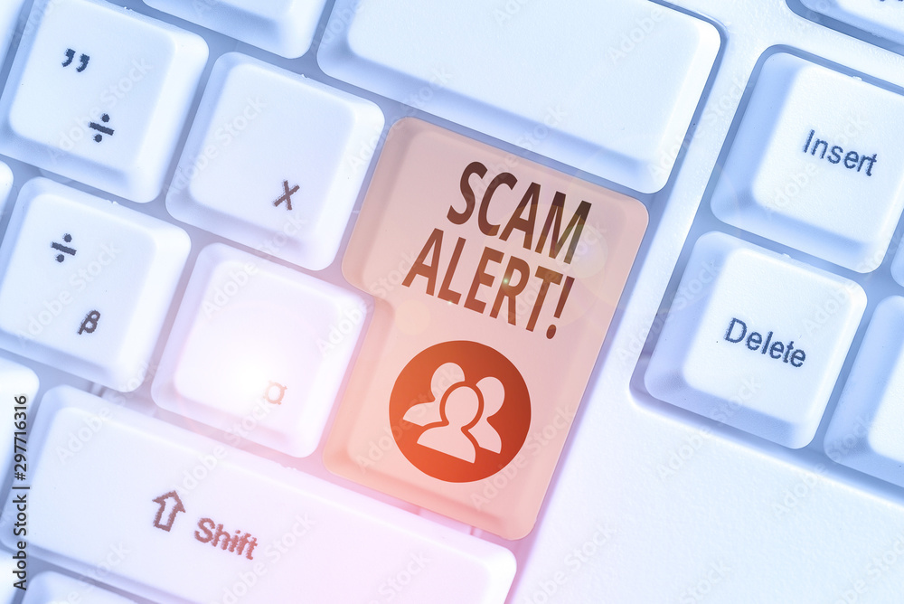 Conceptual hand writing showing Scam Alert. Concept meaning fraudulently obtain money from victim by persuading him White pc keyboard with note paper above the white background Conceptual hand writing showing Scam Alert. Concept meaning fraudulently obtain money from victim by persuading him White pc keyboard with note paper above the white background