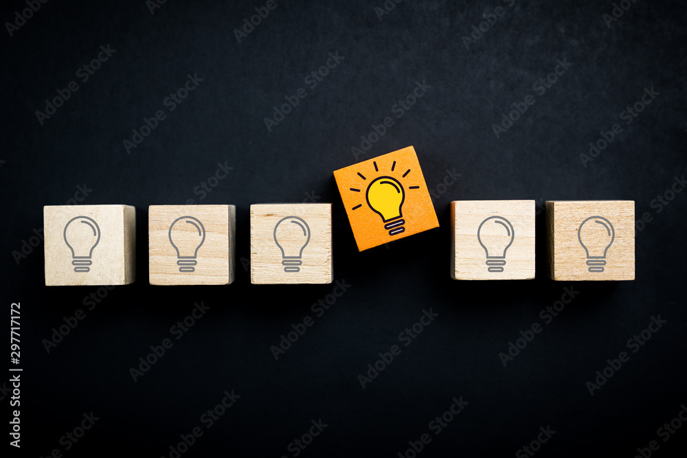 Fotografie Innovation, creative or new idea concept using wood blocks with lightbulb