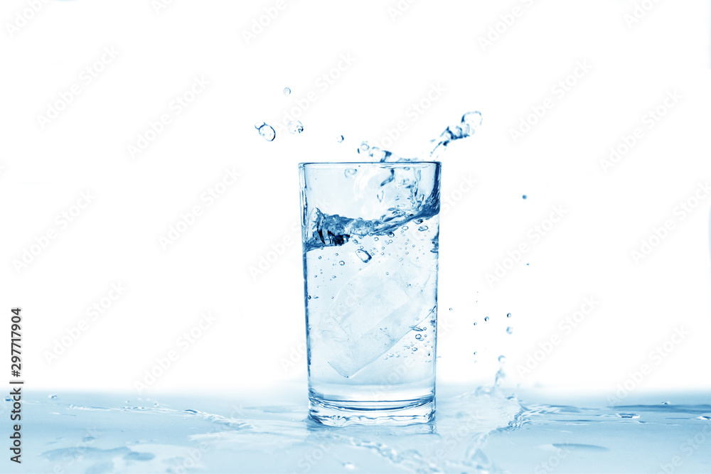 Water splashes in a glass of water isolated white background, copy space Water splashes in a glass of water isolated white background, copy space