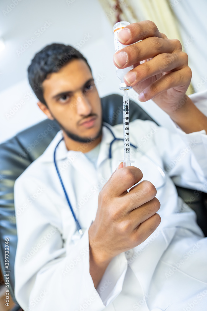 Doctor treating patient with needle Doctor treating patient with needle