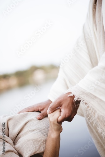Quadro su tela Vertical shot of Jesus Christ healing the female with a blurred background