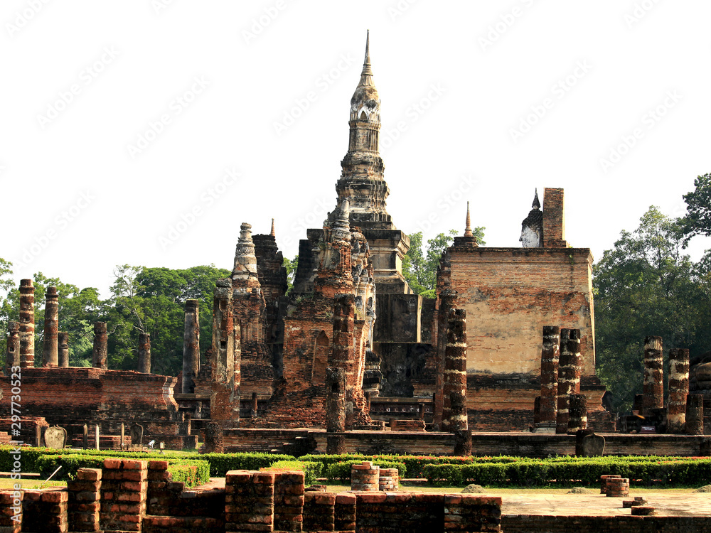 Fototapeta premium Pagoda and archaeological site temple at in Sukhothai historical park, one of popular tourist attractions and famous landmarks, Sukhothai, Thailand. UNESCO world heritage city.