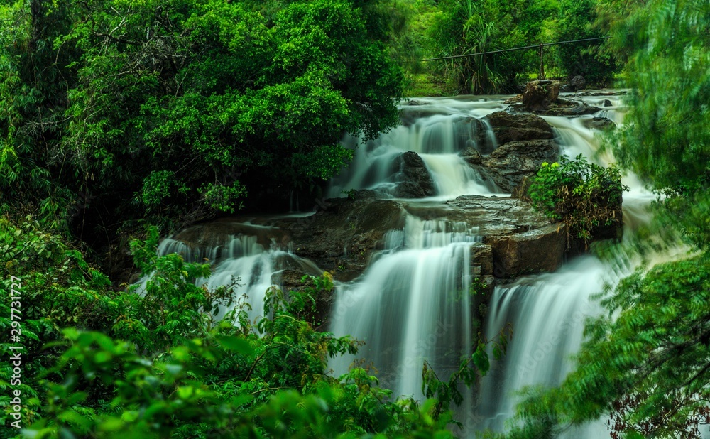 beautiful Sirimane water falls between green trees, in Yadadahalli, Karnataka