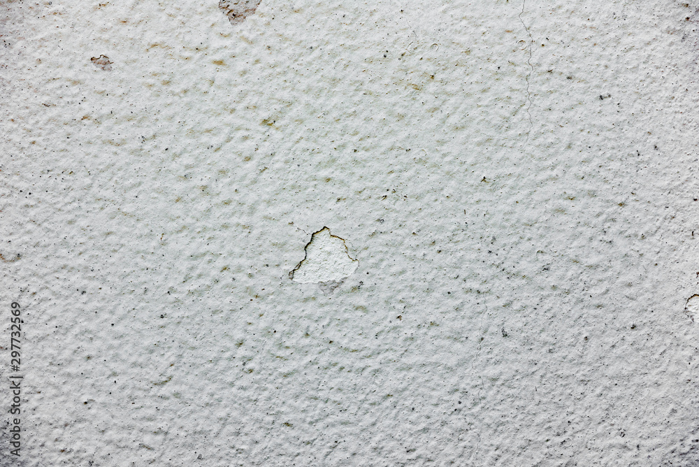 Texture of a concrete wall with cracks and scratches which can be used as a background Texture of a concrete wall with cracks and scratches which can be used as a background