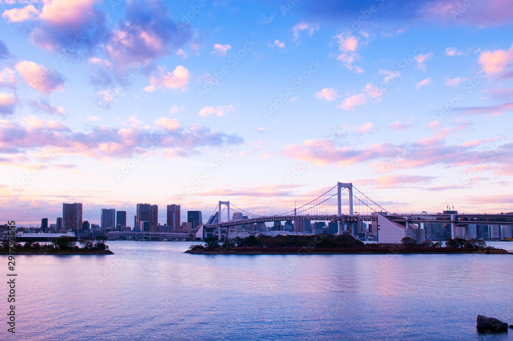 Odaiba Rainbow bridge with Tokyo bay view at evening sunset sky Odaiba Rainbow bridge with Tokyo bay view at evening sunset sky