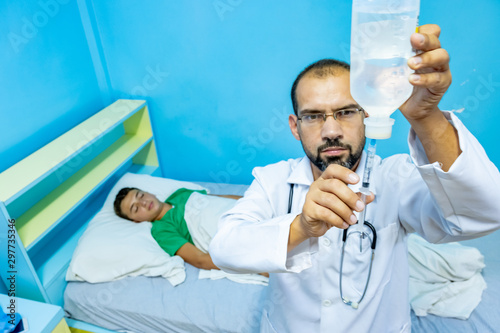 Doctor filling needle to give it to patient