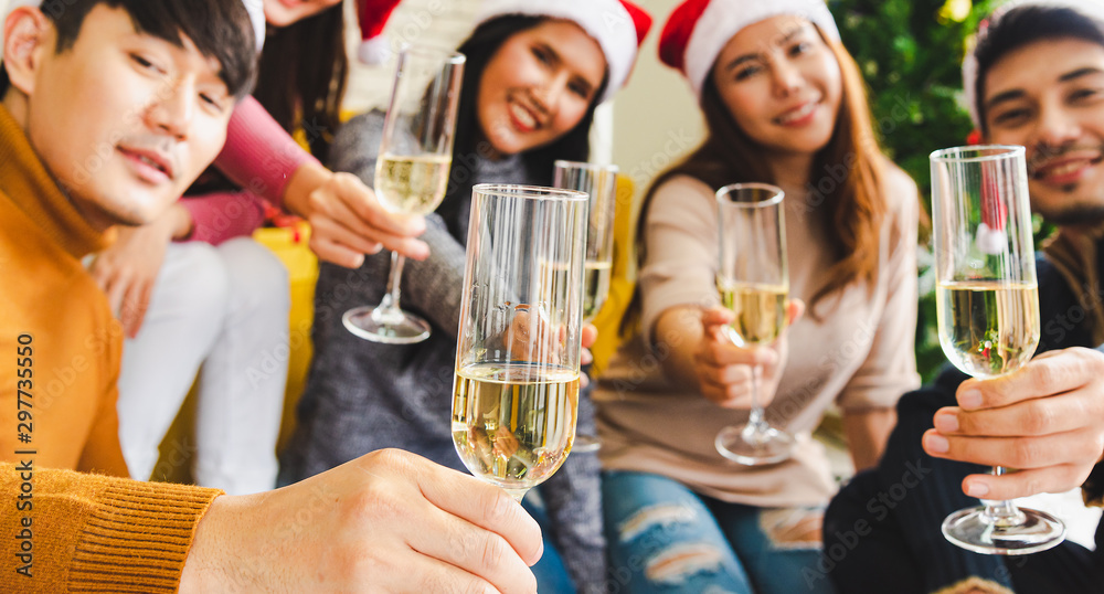 Group of young people in winter season costume drinking champagne for celebrate in Christmas party, Close up style for act invite you to join together