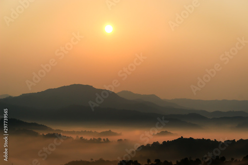 Beautiful scenery of mountain with mist sea and sunrise sky at view point of Na Ton Chan in the early morning, Si Satchanalai, Sukhothai Province , Thailand.