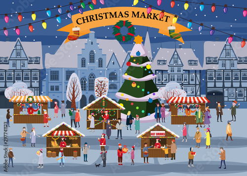 Christmas market or holiday winter outdoor fair on oldtown square big New Year tree cityscape