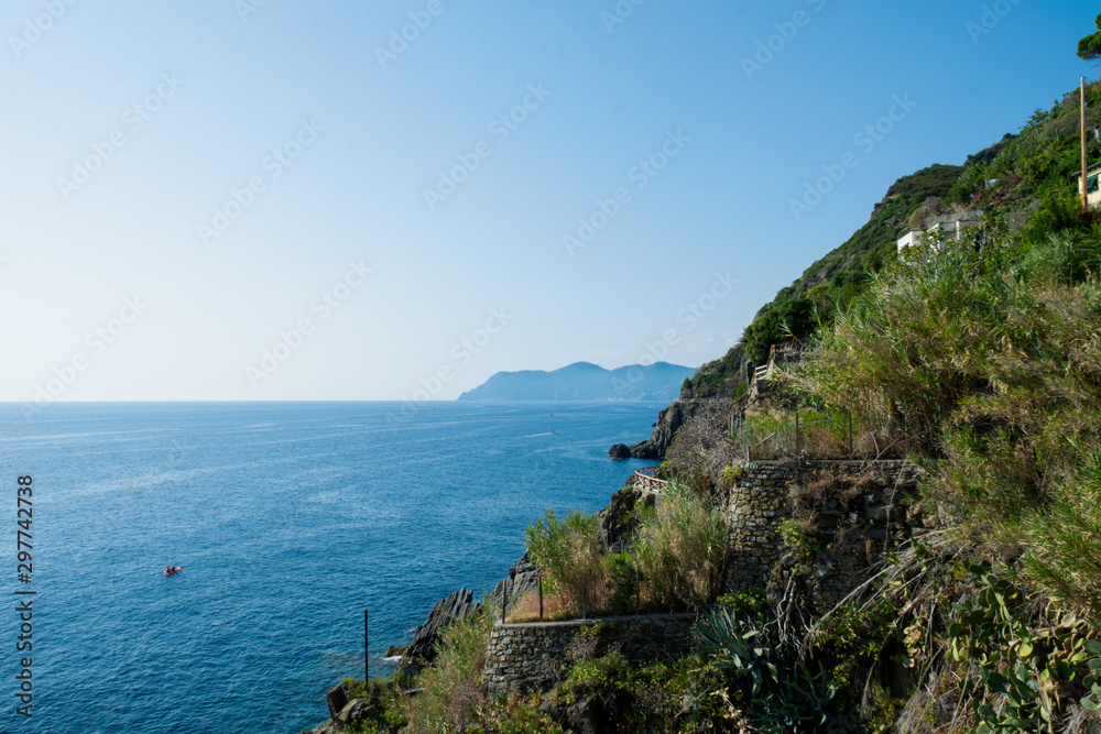 Fototapeta premium Riomaggiore Cliffs over the blue sea, Cinque Terre, La Spezia, Italy