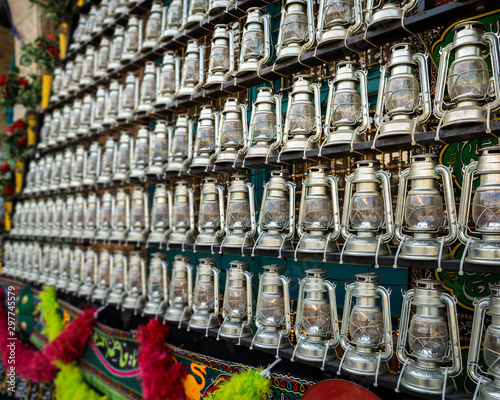 Fotomurale kerosene lamps in front of a mosque, as a symbol of religious mourning of Imam H