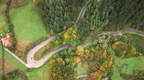 aerial view of curvy road at autumn season © jon_chica