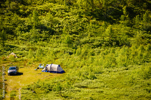 Tent and car on green nature