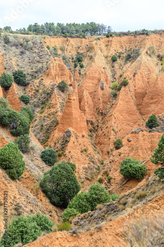 Valley eroded by rain and wind forming ravines in the red clay called Las Carcavas in Madrid